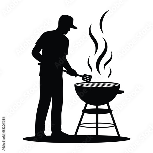 Silhouette of a man grilling food on a barbecue outdoors