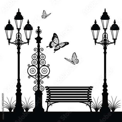 Ornate street lamps and bench with butterflies in silhouette