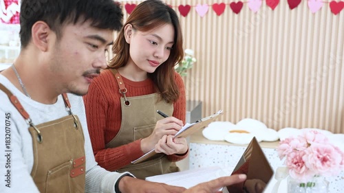 Small business cafe owner couple focusing on accounting task, sharing ideas for business plan, teamwork, motivation, startup lifestyle and modern entrepreneurship, bookkeeping for tax declaration