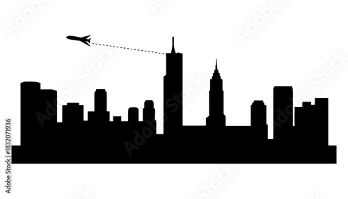 Silhouette of city skyline with airplane flying above the buildings
