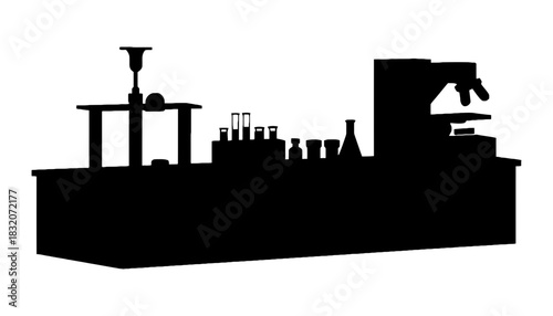 Silhouette of laboratory equipment on table against a white background