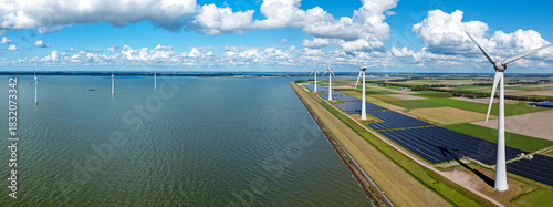 Aerial panorama from wind turbines and solar panels along the IJsselmeer in the Netherlands