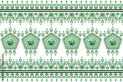 A striking decorative border pattern featuring large, repeating pentagonal geometric medallions framed by traditional tribal arrowhead and diamond motifs in varying shades of green.