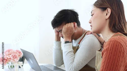 Young coffee shop owner feeling stressed while working on early business results, inexperienced entrepreneurs facing financial difficulty, lack learning, emotional pressure in small business startup