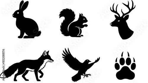 Silhouettes of forest animals and a paw print on white background, Vector