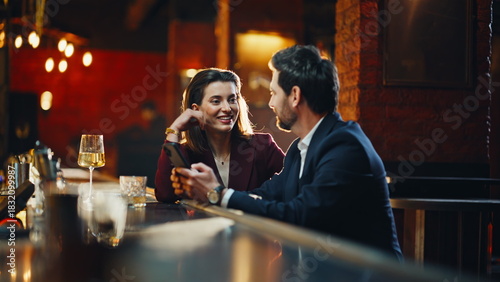 Bild auf Leinwand Gentleman lady relaxing together night bar discussing smartphone