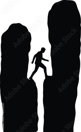 Silhouette climber navigates narrow mountain gap