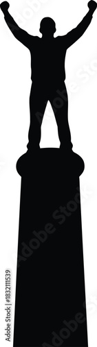 Silhouette of victorious man on pedestal arms raised