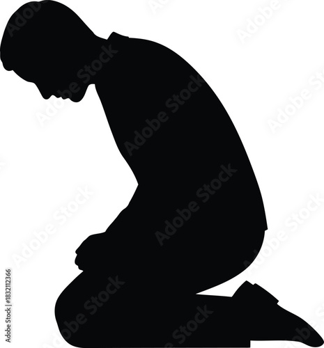 Silhouette of man praying on knees