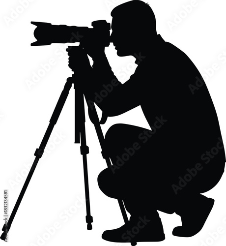 WebBlack Silhouette of Photographer Crouching Behind Camera on Tripod, Focusing and Capturing Professional Photography and Media Content