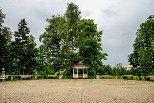 Peaceful Park Gazebo With Trees, Benches, And Ope Brick Pathway Surroundings On Poklonnaya Hill, Moscow, Russia, 10 August 2025