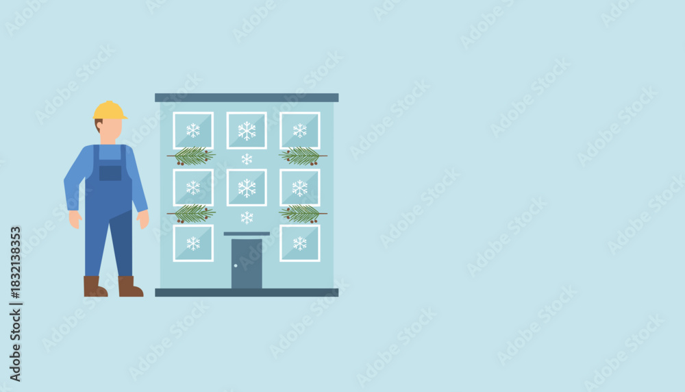 Fototapeta premium Maintenance worker standing by a building decorated for the winter holidays