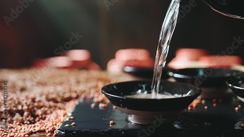 Empty Black Ceramic Bowls on Textured Surface with Warm Lighting for Food Presentation