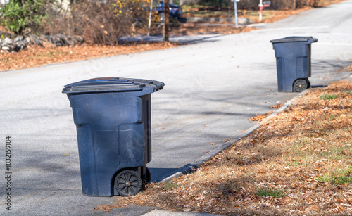 blue trash can  on the residential street