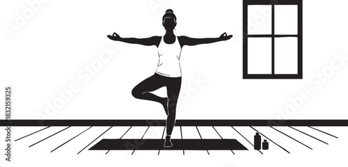 Silhouette of woman practicing tree pose yoga on mat indoors
