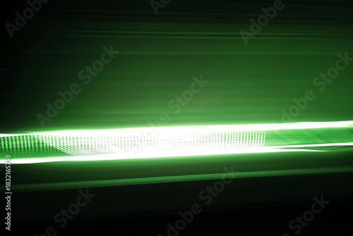 Selective focus photography. A frame in motion. Abstract background. Colorful image. Long shutter speed. Light streaks. Movement of transportation. Shooting from transportation. Blurred image.