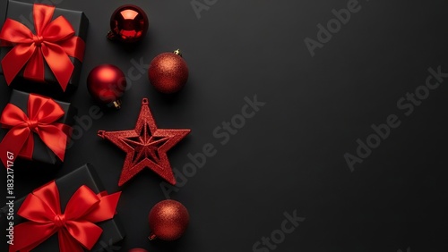 A stylish Christmas composition featuring black gift boxes wrapped with bright red ribbons, surrounded by red ornaments and decorative elements on a dark background.
