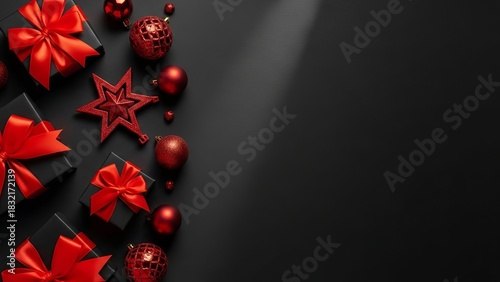 A stylish Christmas composition featuring black gift boxes wrapped with bright red ribbons, surrounded by red ornaments and decorative elements on a dark background.
