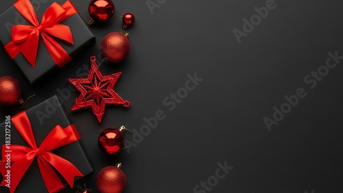 A stylish Christmas composition featuring black gift boxes wrapped with bright red ribbons, surrounded by red ornaments and decorative elements on a dark background.