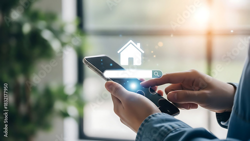 Woman using a mobile phone to search for a house to buy or rent online