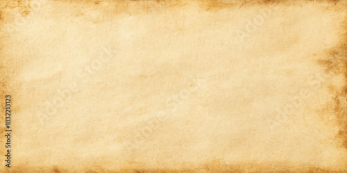 Aged vintage parchment background with a stained brown antique paper texture featuring a grungy worn pattern on a blank retro sheet for ancient document design