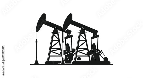 black and white image of three oil pumps standing in an open field silhouette