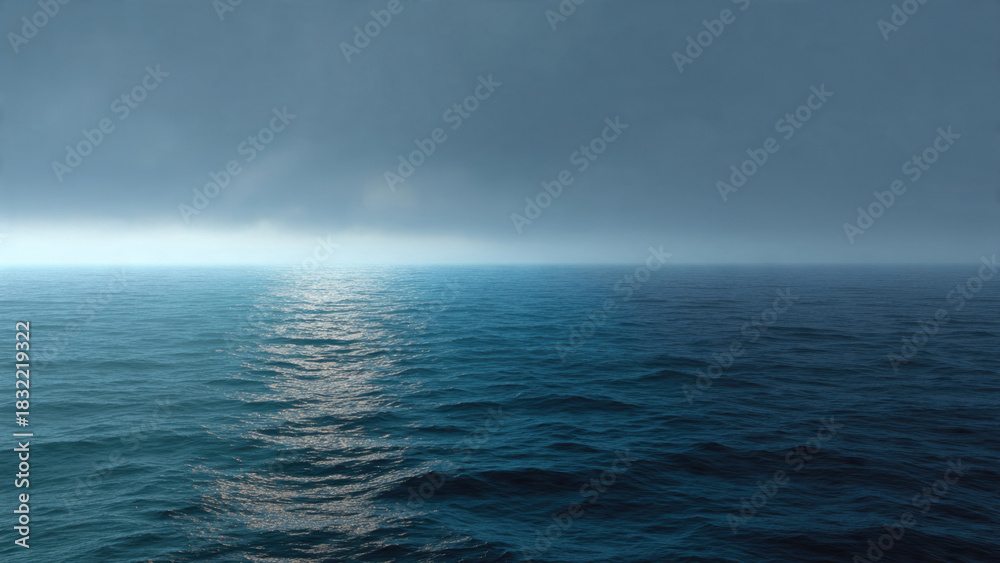 Fototapeta premium Vast, tranquil ocean under an overcast sky. Light shimmers on lighter blue water, transitioning to deeper, darker tones across the seascape.