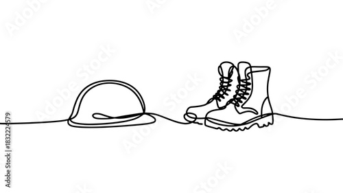 army boots beside a soldier helmet, suitable for themes of military service, duty, history, and remembrance.