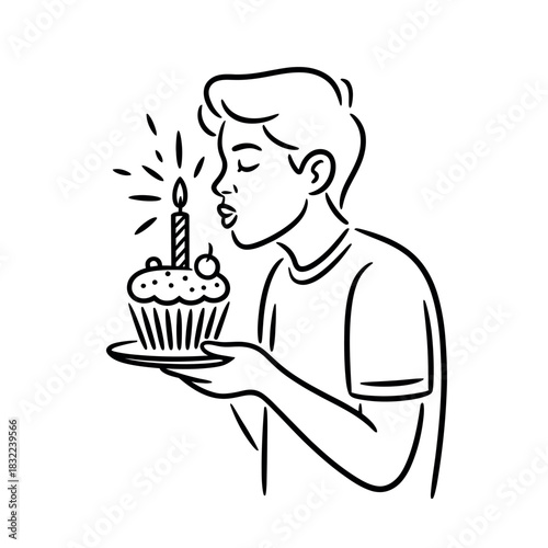 A young person blows out the candle on a birthday cupcake, celebrating a special occasion.