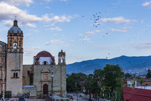 Church in Mexico with birds in a bright blue sky