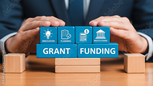 Hands protecting grant funding blocks with icons representing business and finance