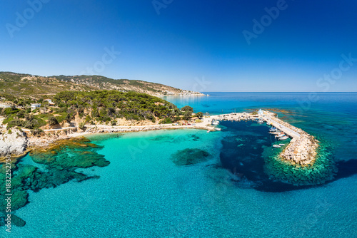 The beach and port of Gialiskari and the chapel Analipsi, Ascention in Ikaria, Greece