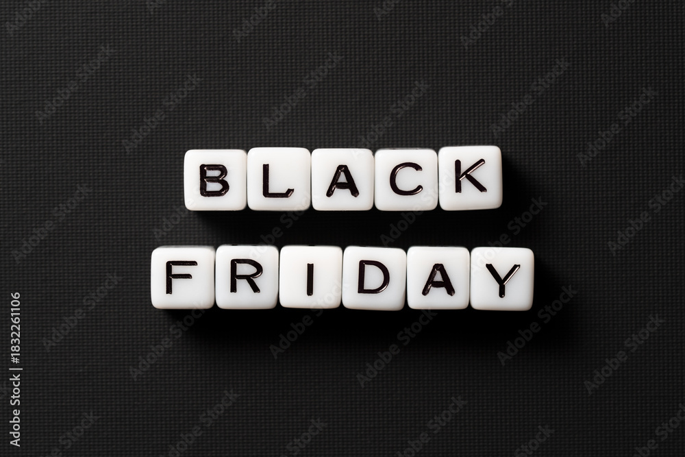 Obraz premium Close-up of Black Friday sale text made of acrylic beads on a black background. High-resolution photo. Discount cards.