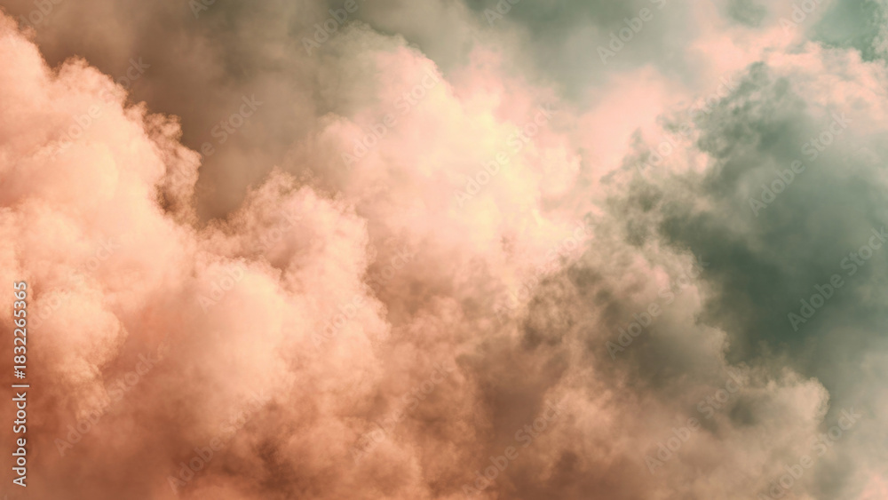 Obraz premium Dramatic sky with atmospheric clouds showcasing a beautiful gradient from warm peach and pink tones to cool, dark teal and green hues.