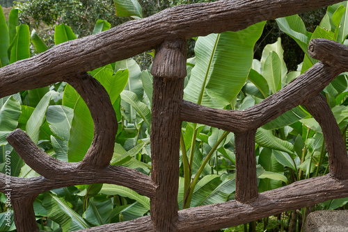 Vara Blanca, Costa Rica - November 14, 2024 - the La Paz Waterfall Gardens Nature Park - stone staircase with a unique wooden railing in a lush tropical garden