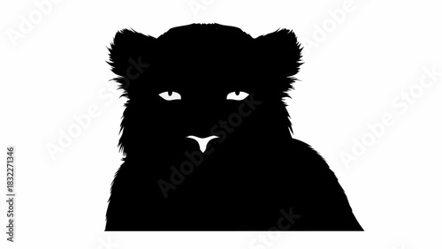 Silhouette of a lion cub with fluffy fur and glowing eyes staring directly at the viewer intensely