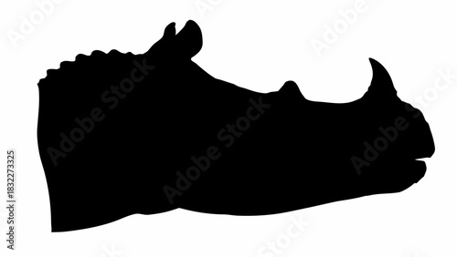 Silhouette of a rhinoceros head showing its horn and ear in a side profile against white backdrop