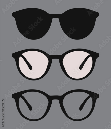 An empty frame is decorated with two glasses in black and white