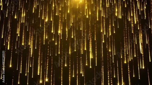 Abstract golden rain of light particles in motion