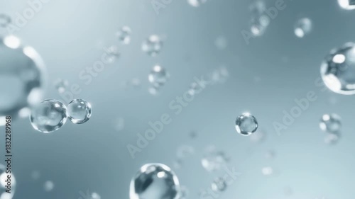 Abstract macro view of pure water droplets suspended in the air, creating a serene and clean scientific background with a shallow depth of field