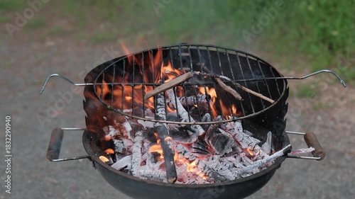 Charcoal grill with burning coals. Closeup of burning coals in a fireplace or barbecue grill.
