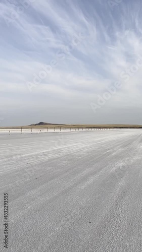 Salt lake Baskunchak with strips of salt workings left after salt mining. Mount Bogdo. Astrakhan region, Russia.
