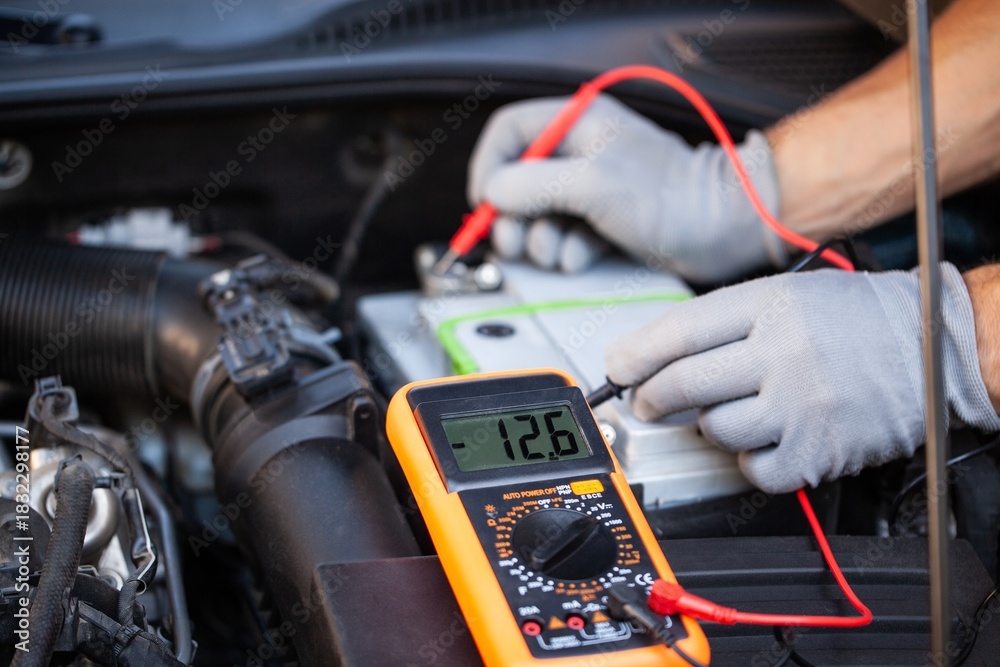 Obraz premium Hands car mechanic repair service checks electrical circuits