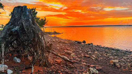 Sunset on the lake where naturral colors look like clouds are on fire