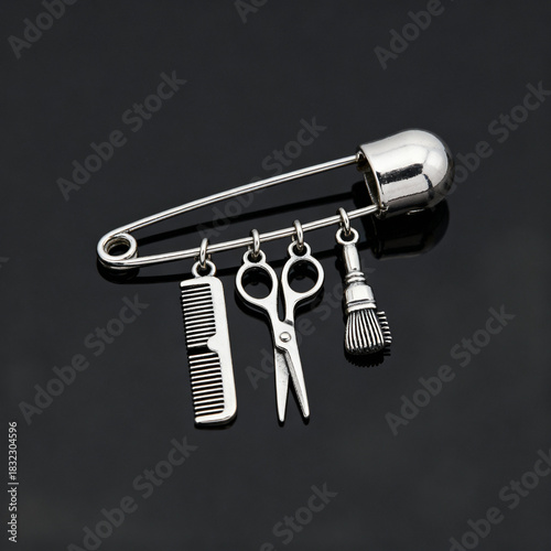 Silver safety pin pendant with hairdressing tools attached  