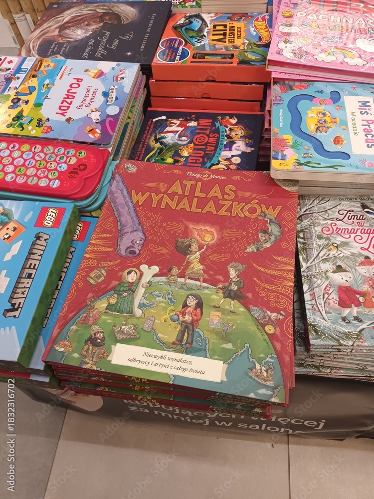 Naklejka premium Books Displayed on a Shelf Featuring