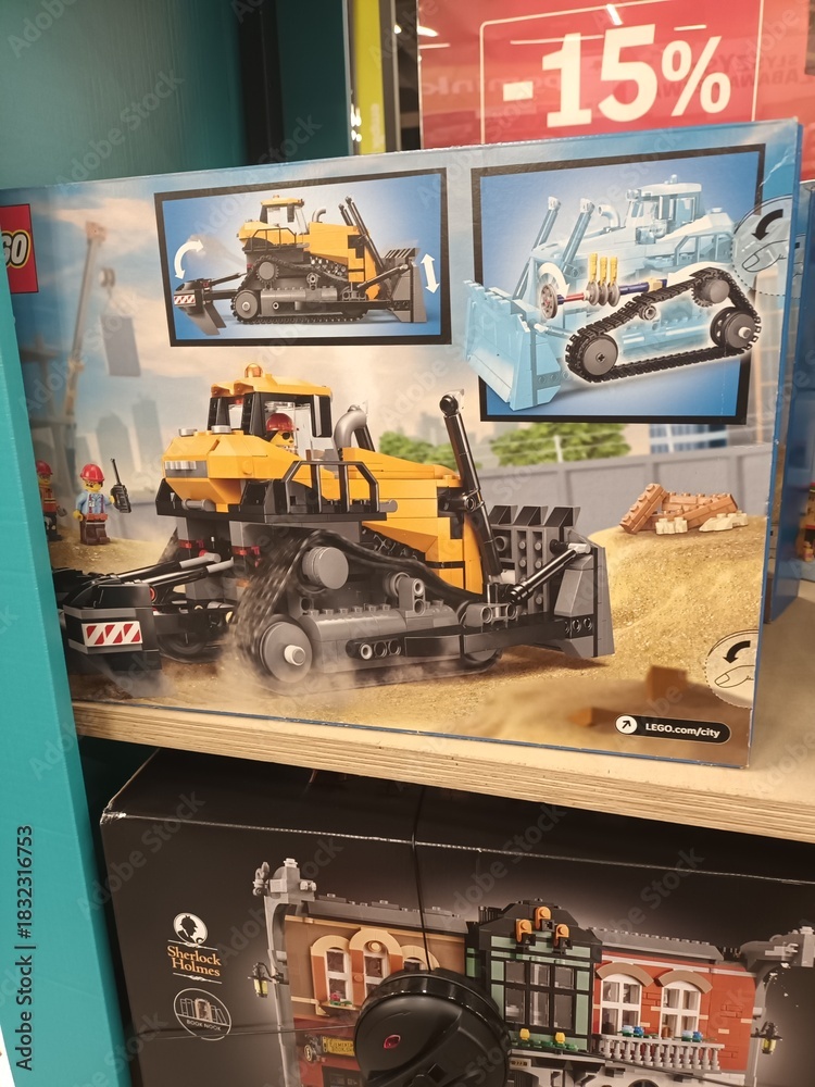 Naklejka premium LEGO City construction bulldozer toy set box displayed for sale on a retail shelf in a store