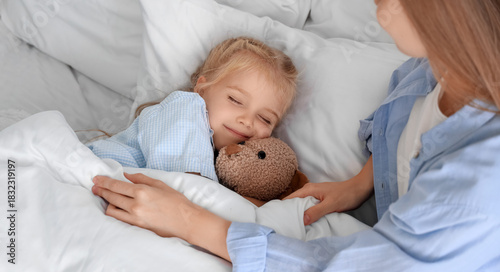 Cute little girl with toy b...