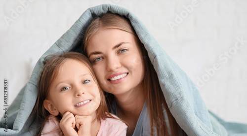 Cute little girl and her mo...