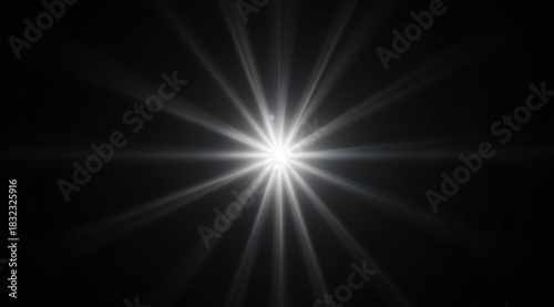 Abstract shining star with soft long rays on a black background. A symbol of hope, inspiration and energy; suitable for logos, screensavers and web design.